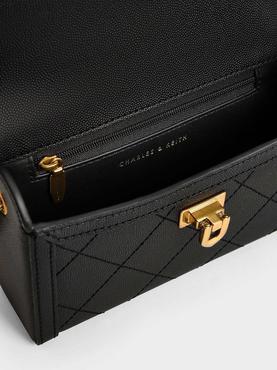 Black Tallulah Quilted Push Lock Clutch CHARLES KEITH AR