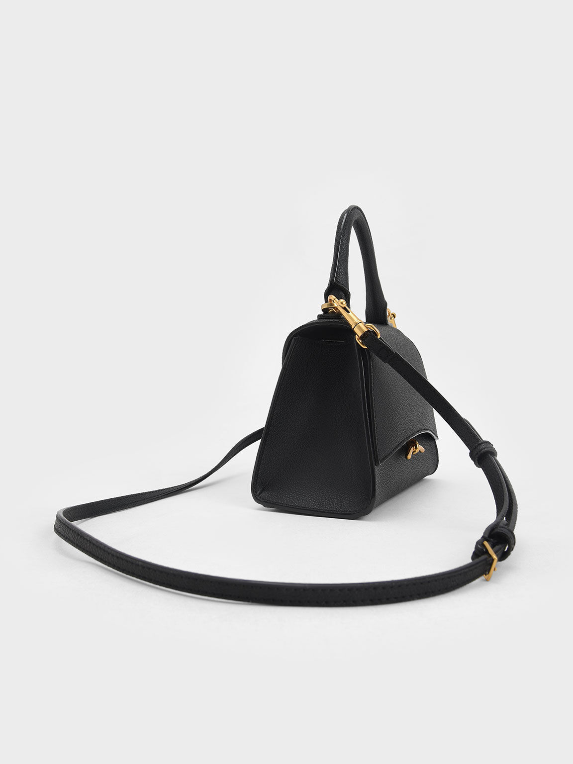 Black Huxley Metallic Push-Lock Top Handle Bag - CHARLES & KEITH US