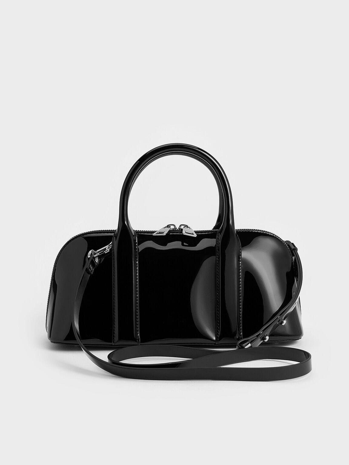 Black Axel Patent Elongated Bowling Bag CHARLES KEITH CA