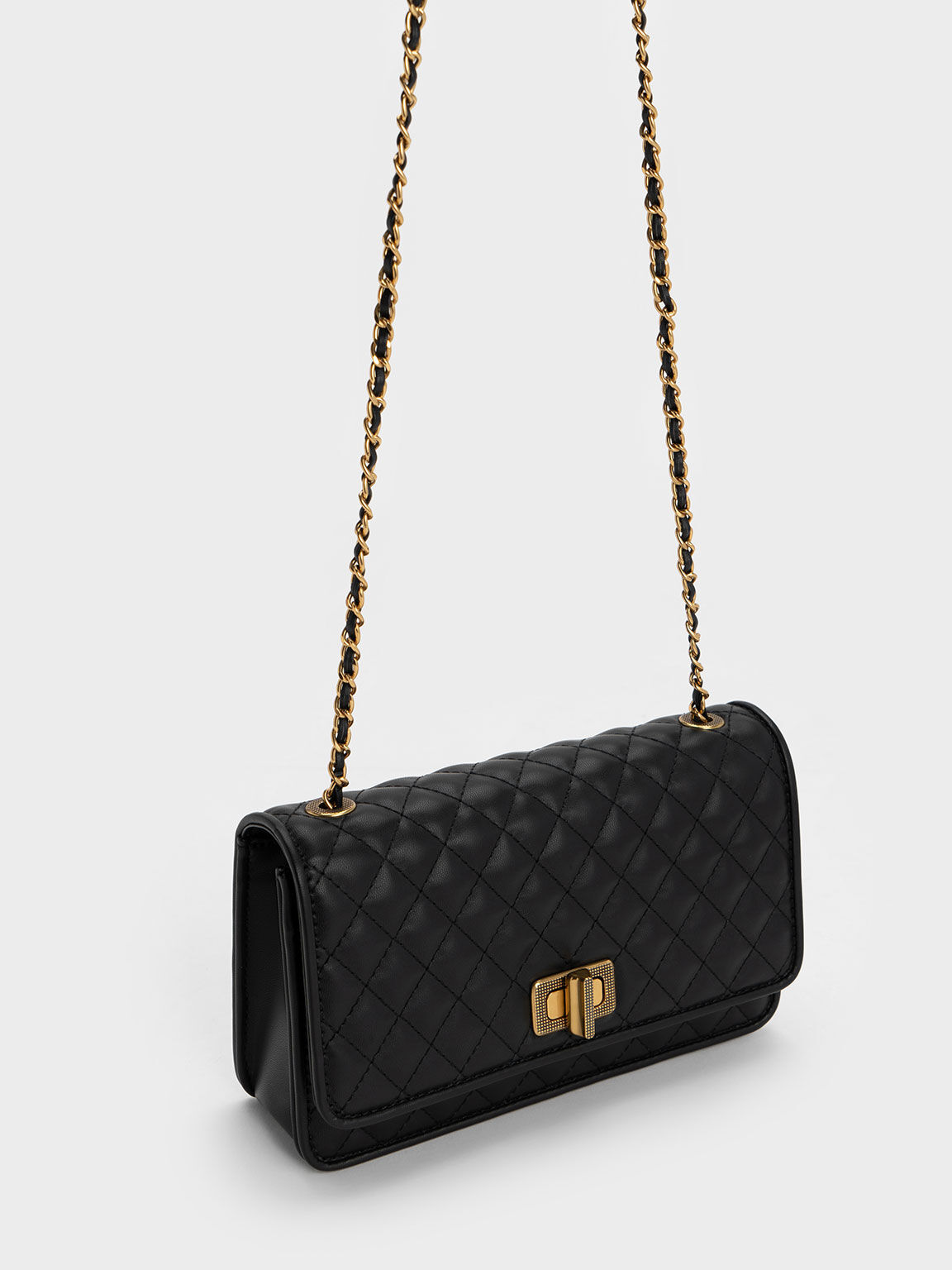 Black Metallic Turn Lock Quilted Clutch CHARLES KEITH MO