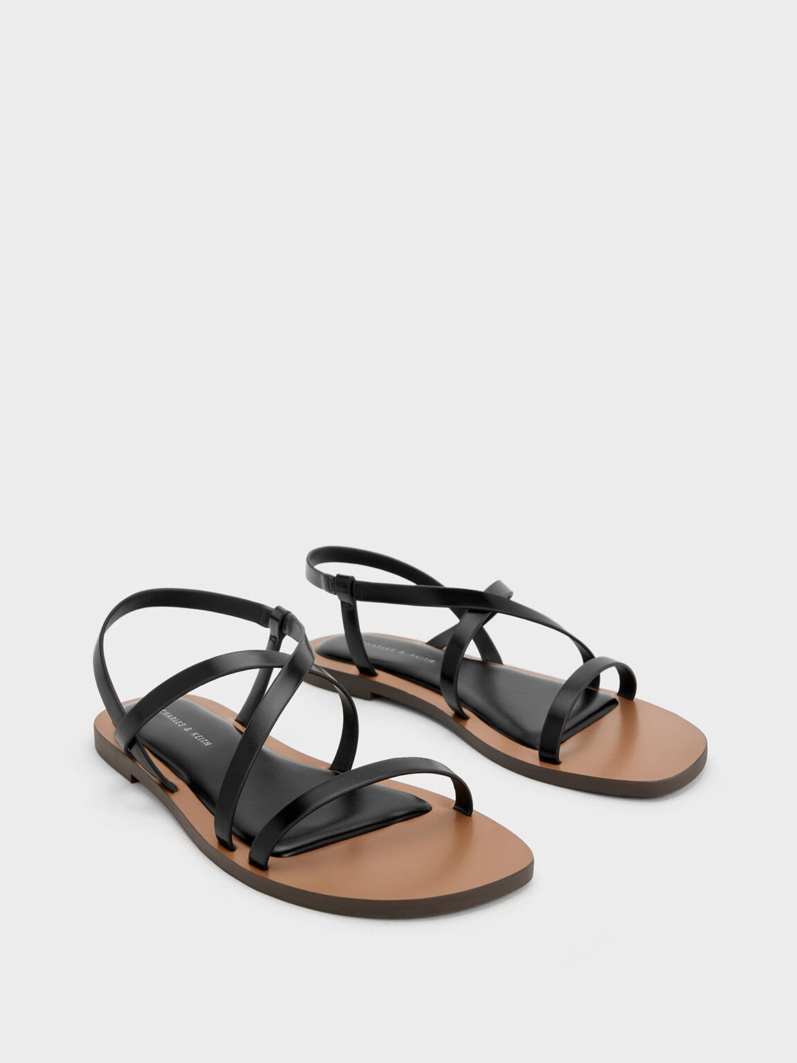 Asymmetrical clearance flat sandal