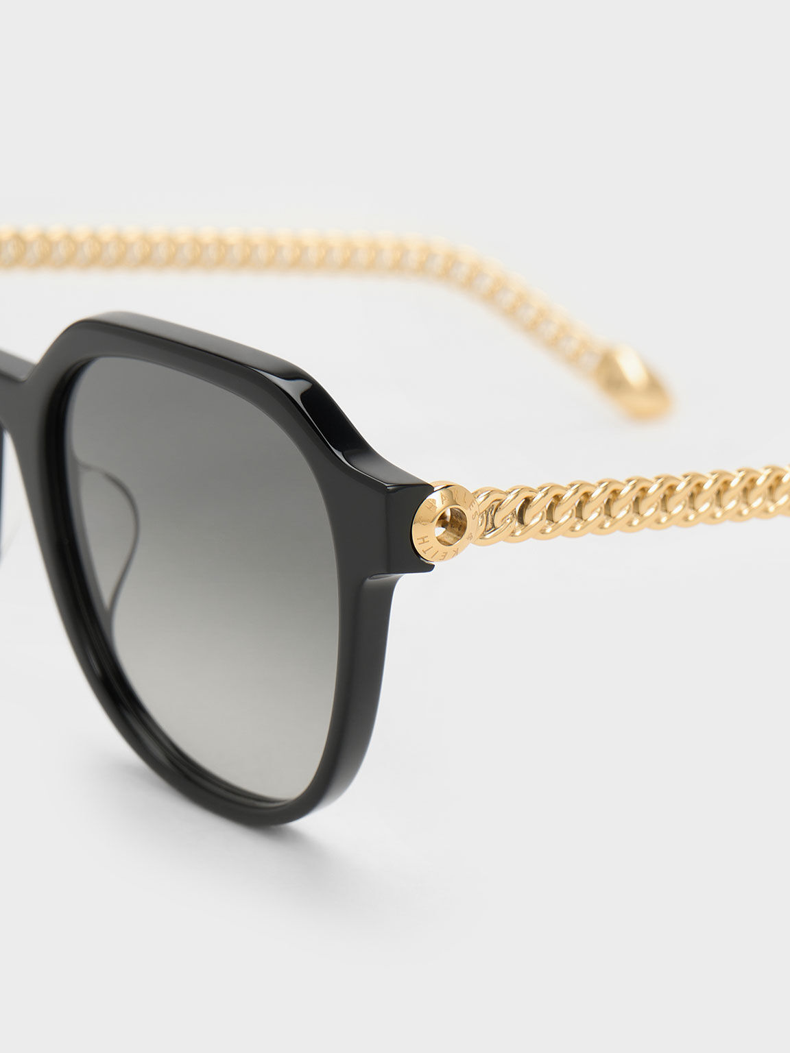 Black sunglasses with gold chain sides best sale