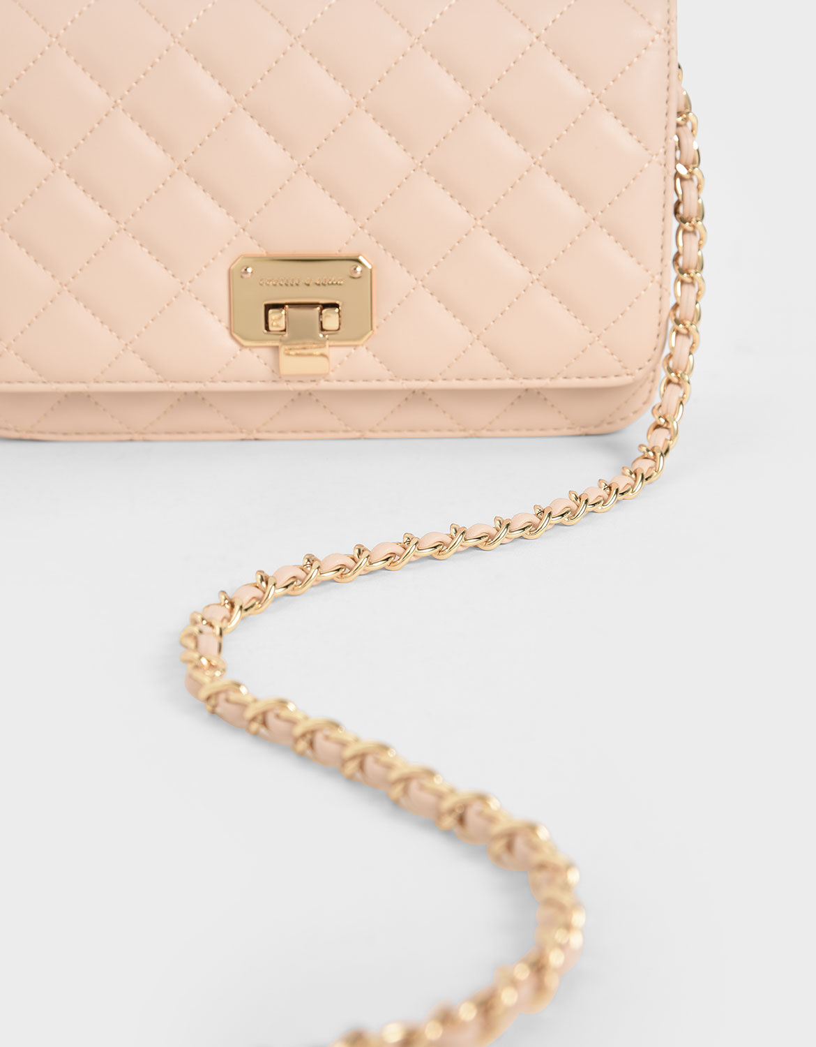 Charles and keith store quilted flip lock clutch