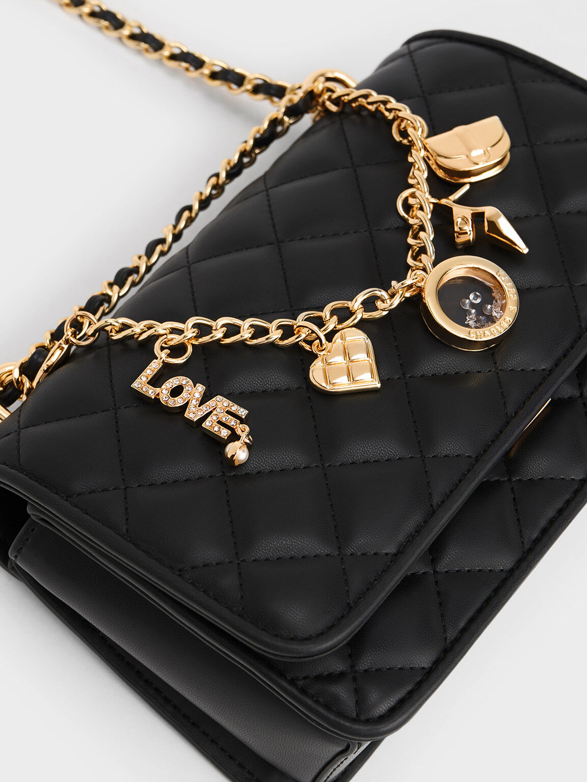 Charm Embellished Quilted Clutch Black
