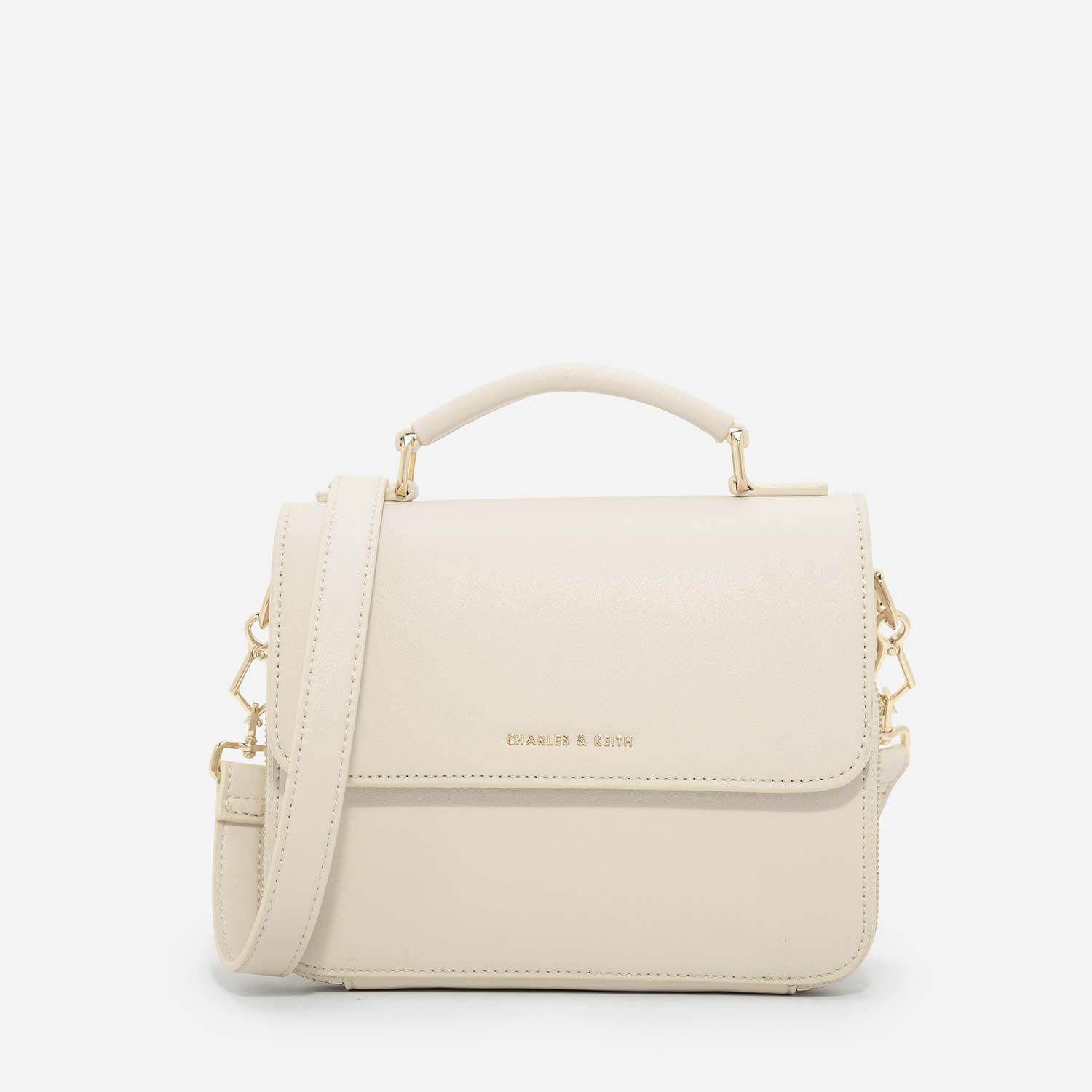 the status flap crossbody bag