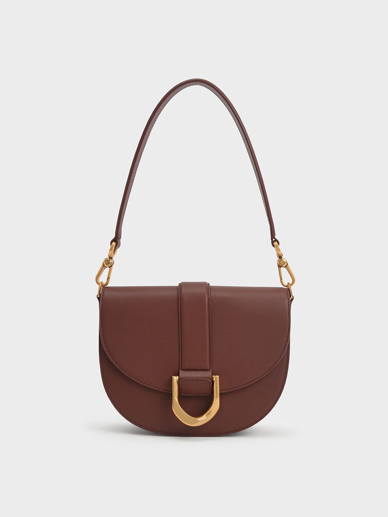 Charles_Keith on X: The Gabine leather saddle bag and buckled