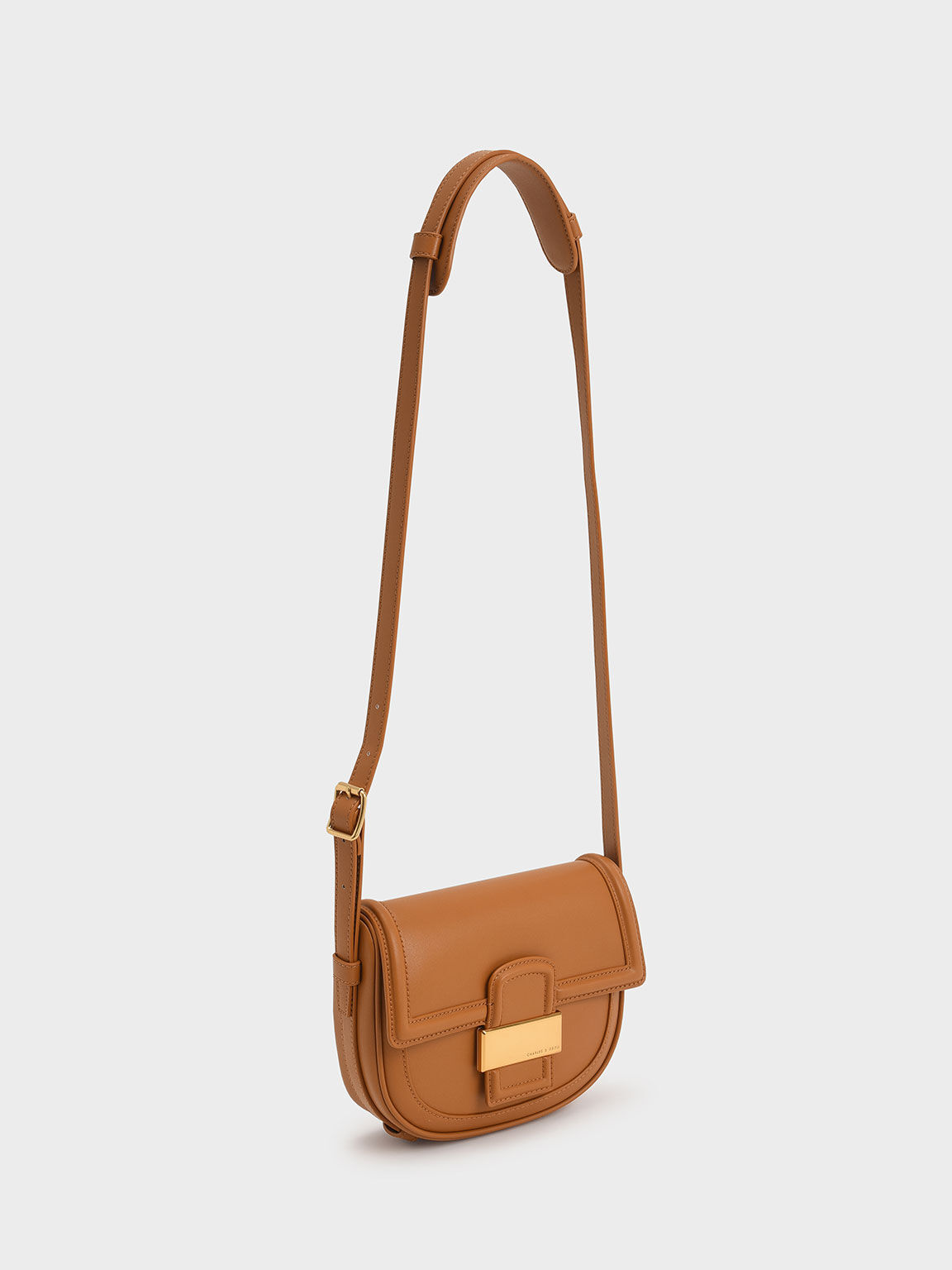 Cognac Aurea Metallic-Accent Saddle Crossbody Bag - CHARLES Cognac Aurea Metallic-Accent Saddle Crossbody Bag - CHARLES