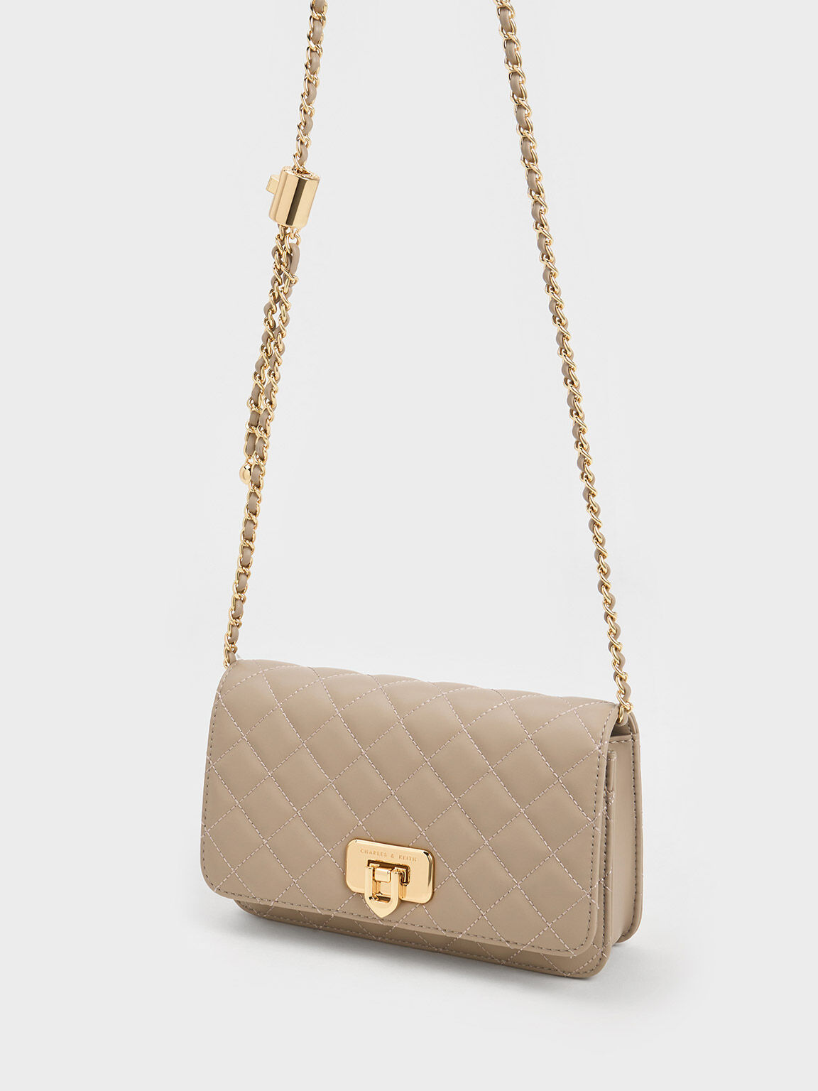 Cream patent clutch bag top