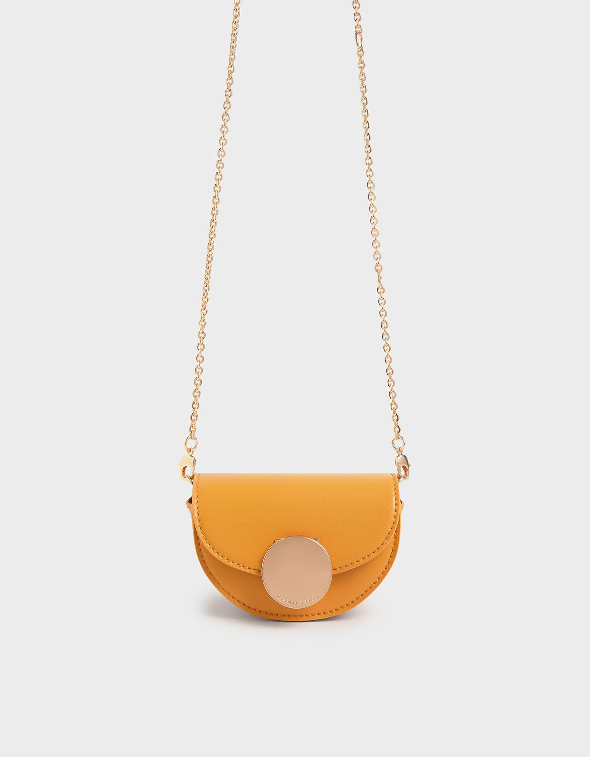circular push lock crossbody bag