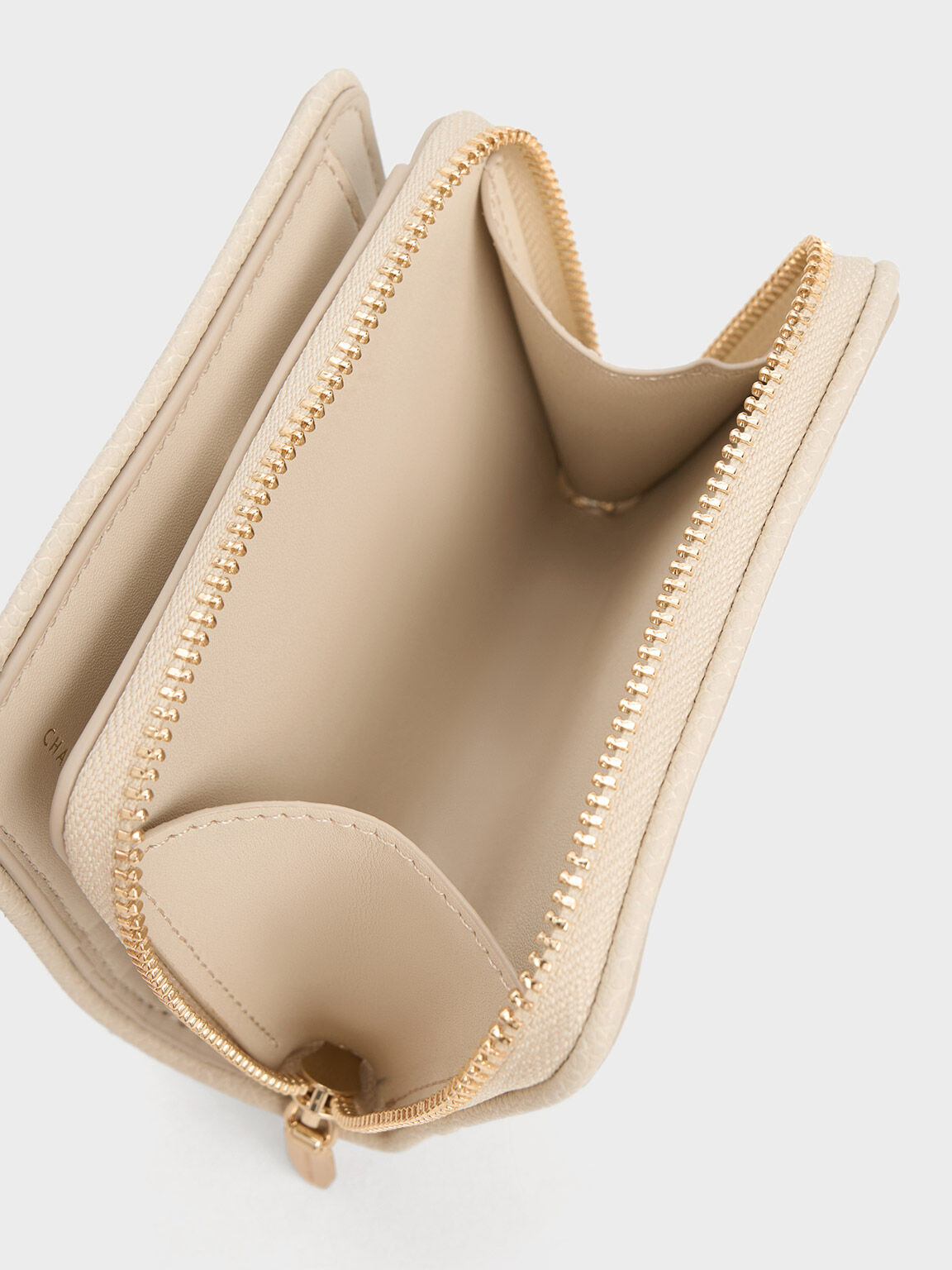 Charles and keith best sale woven zip around wallet