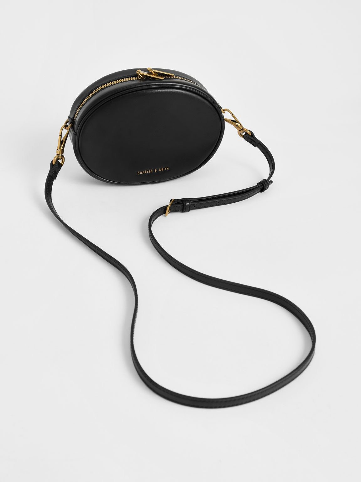 Chain-Embellished Oval Crossbody Bag - Black