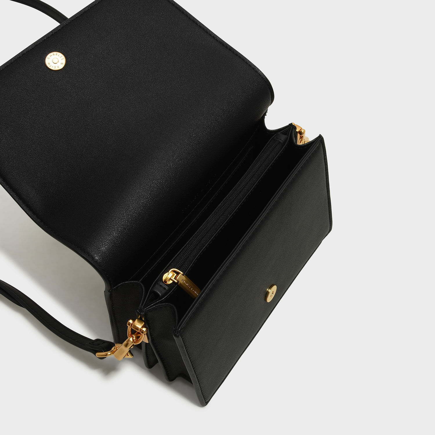 charles and keith asymmetric front flap bag