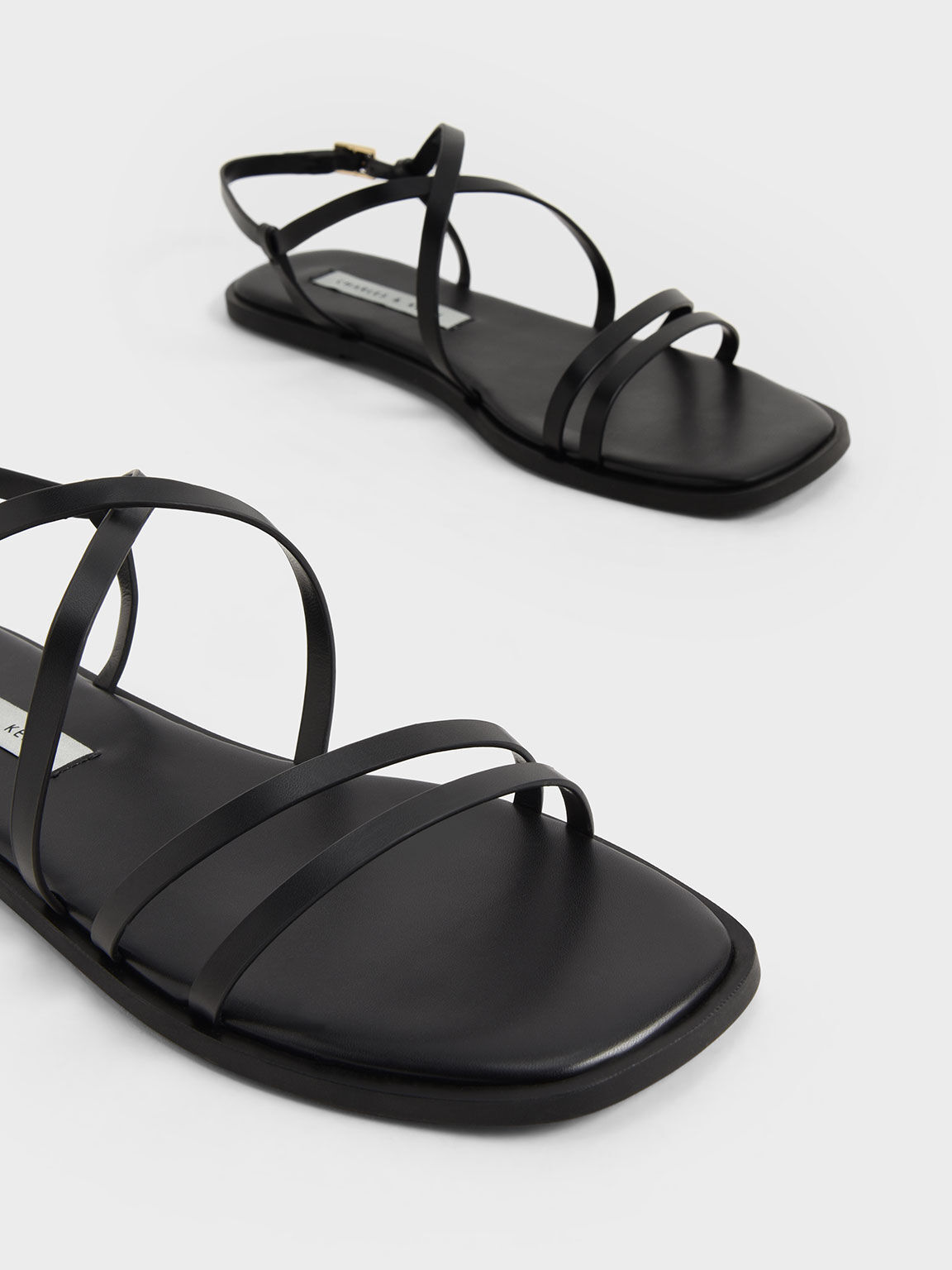 Black strappy flats