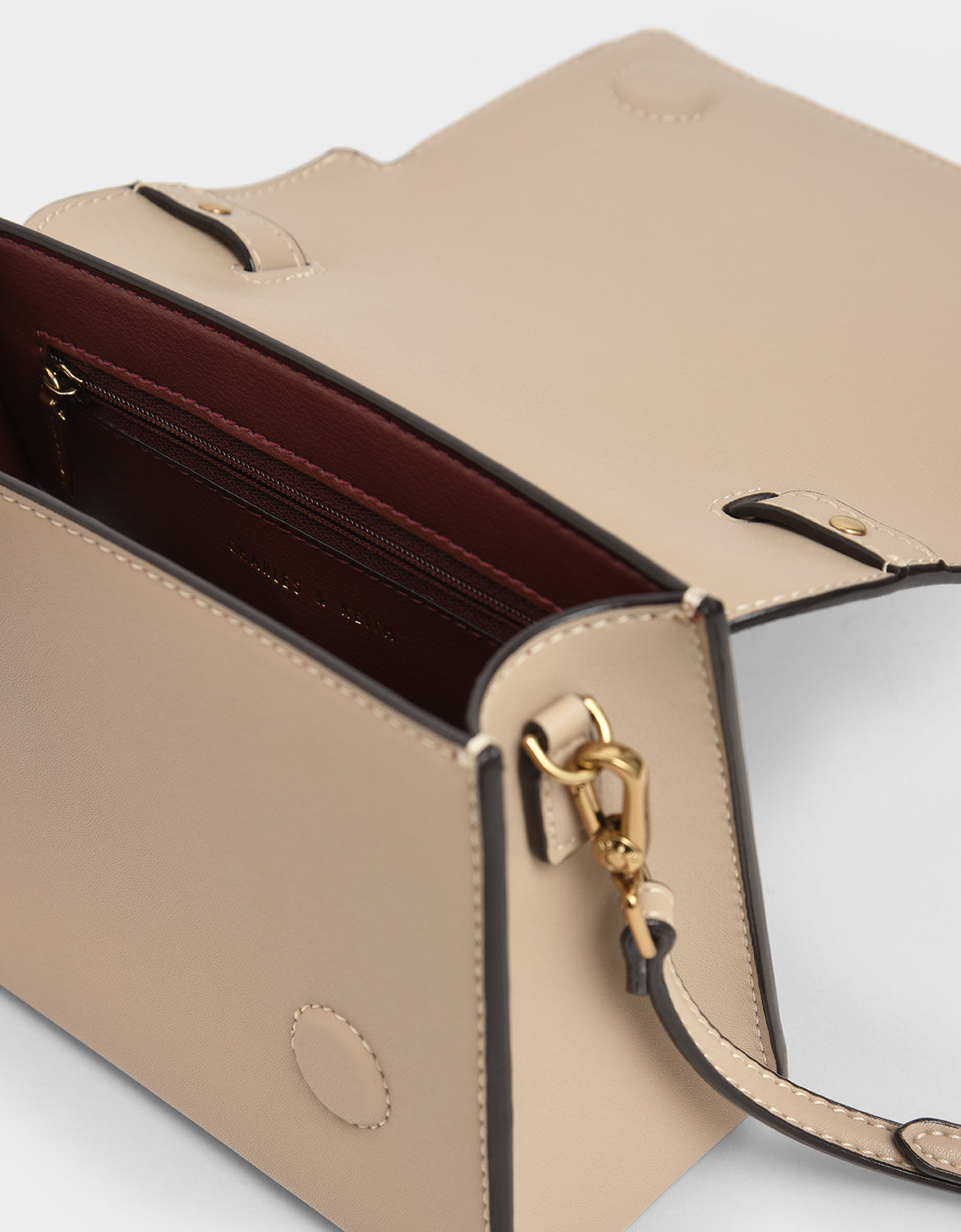 charles & keith chunky metal top handle bow flap bag
