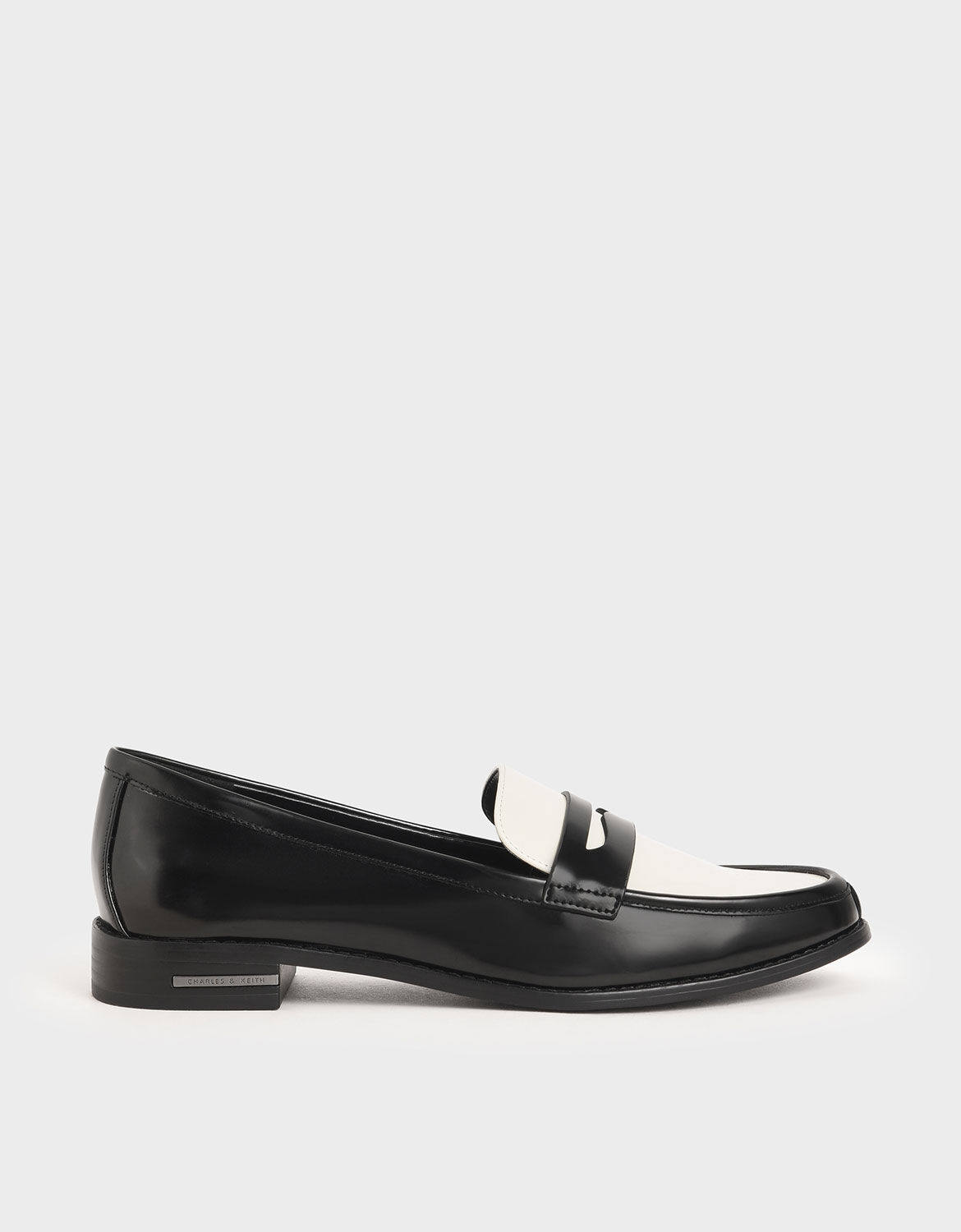 white and black penny loafers