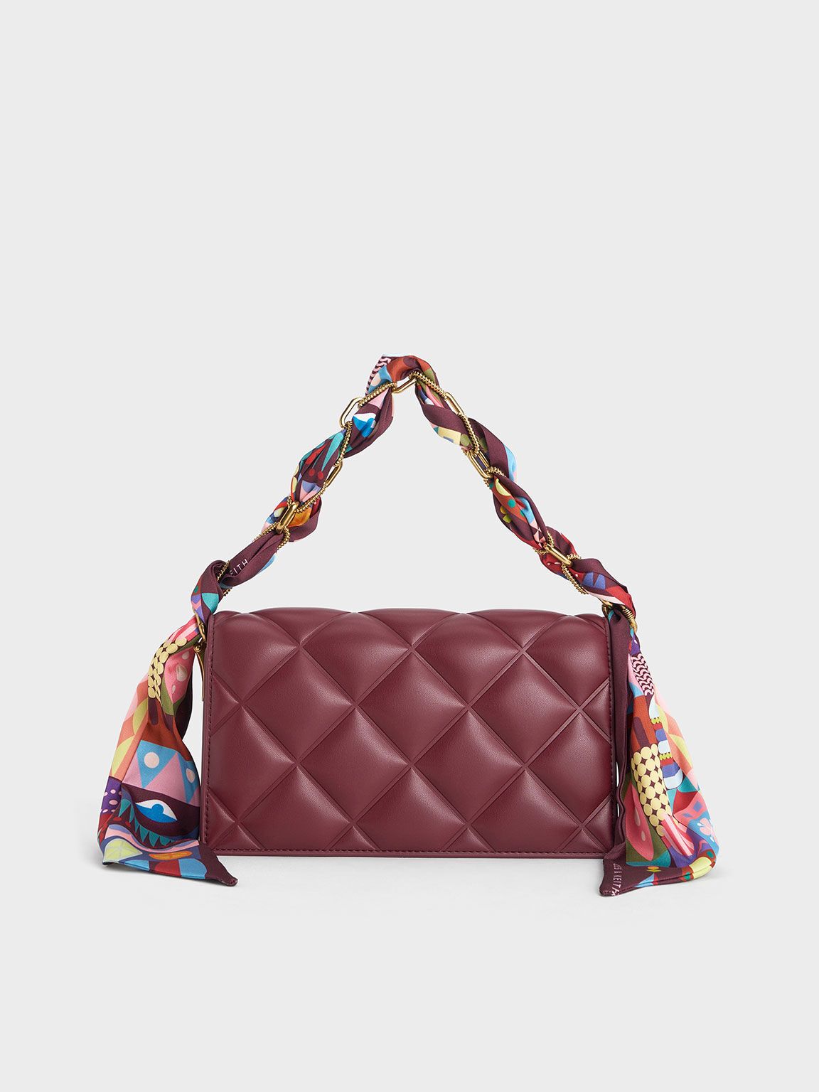 Quilted clutch online charles and keith