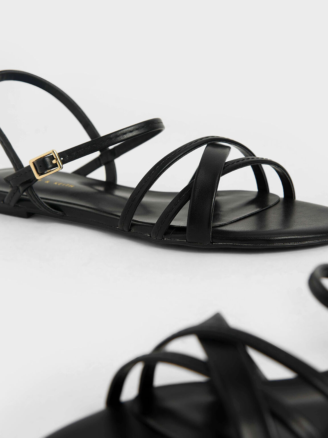 black criss cross flats