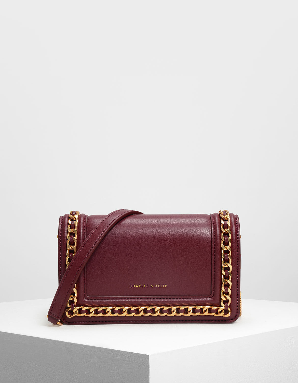 Charles and keith discount chain rimmed clutch