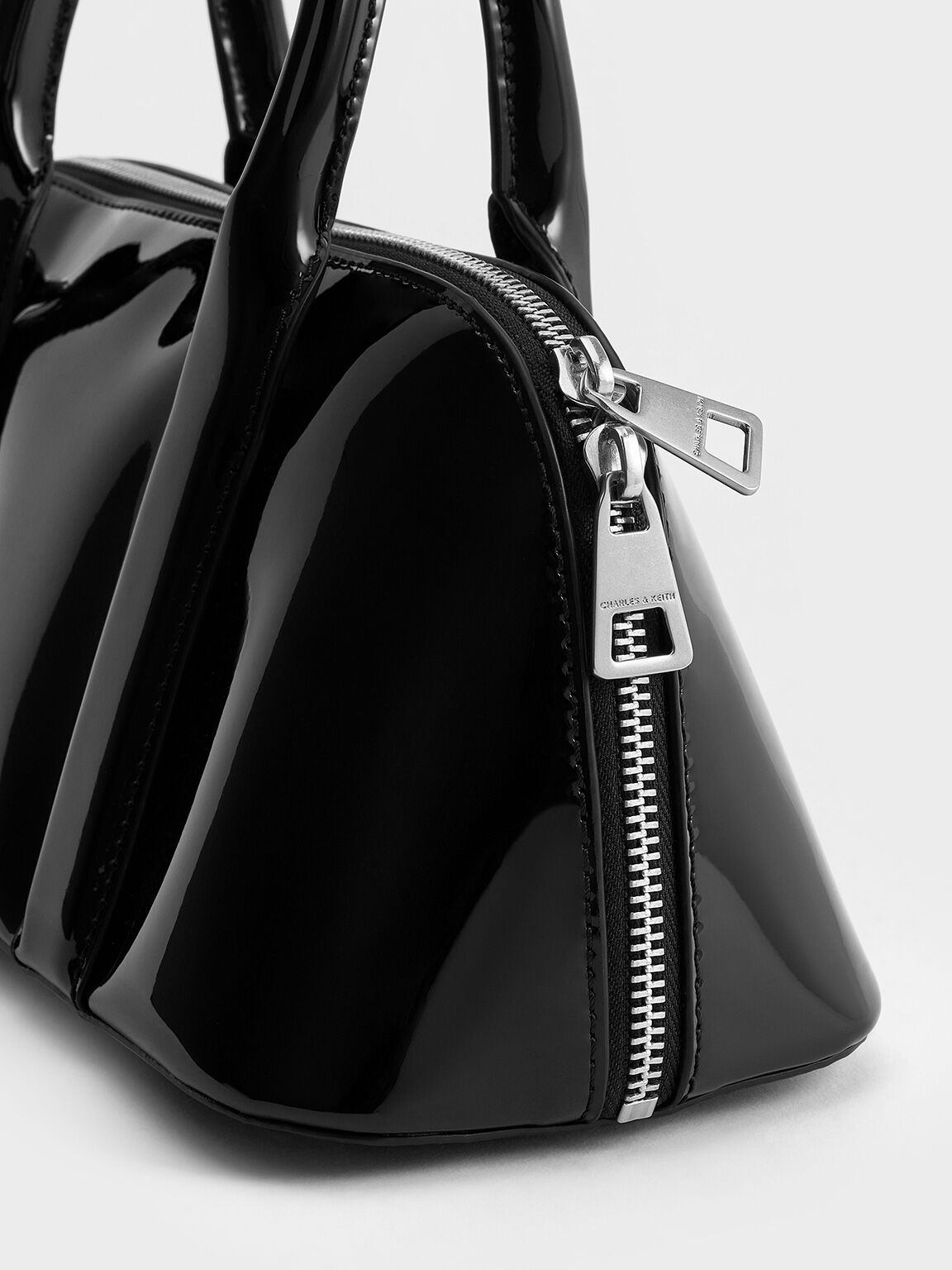 Black Axel Patent Elongated Bowling Bag CHARLES KEITH CA