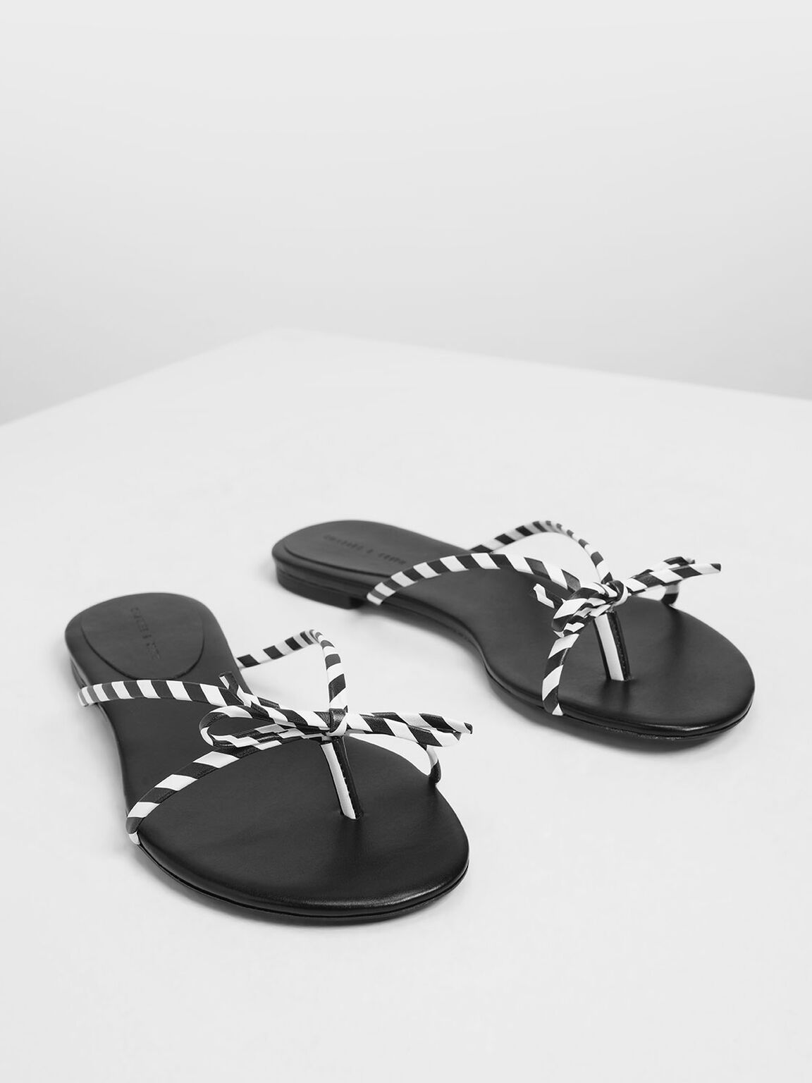 Strappy Bow Black And White Stripe Thong Sandals