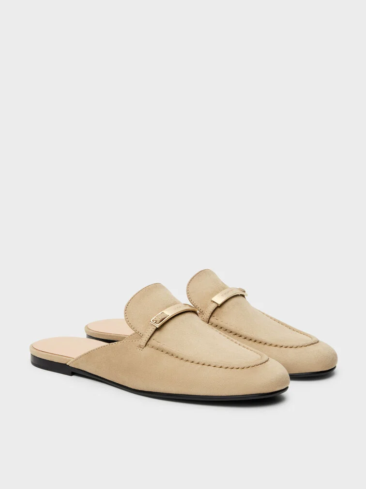 Classic penny loafers feature distinctive cut-out straps across the vamps.