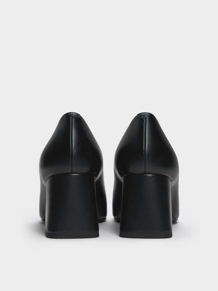 Black loafers pumps with block heels.