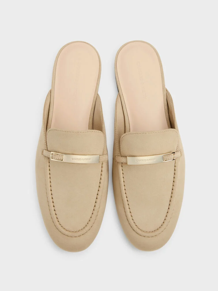 Classic penny loafers feature distinctive cut-out straps across the vamps.