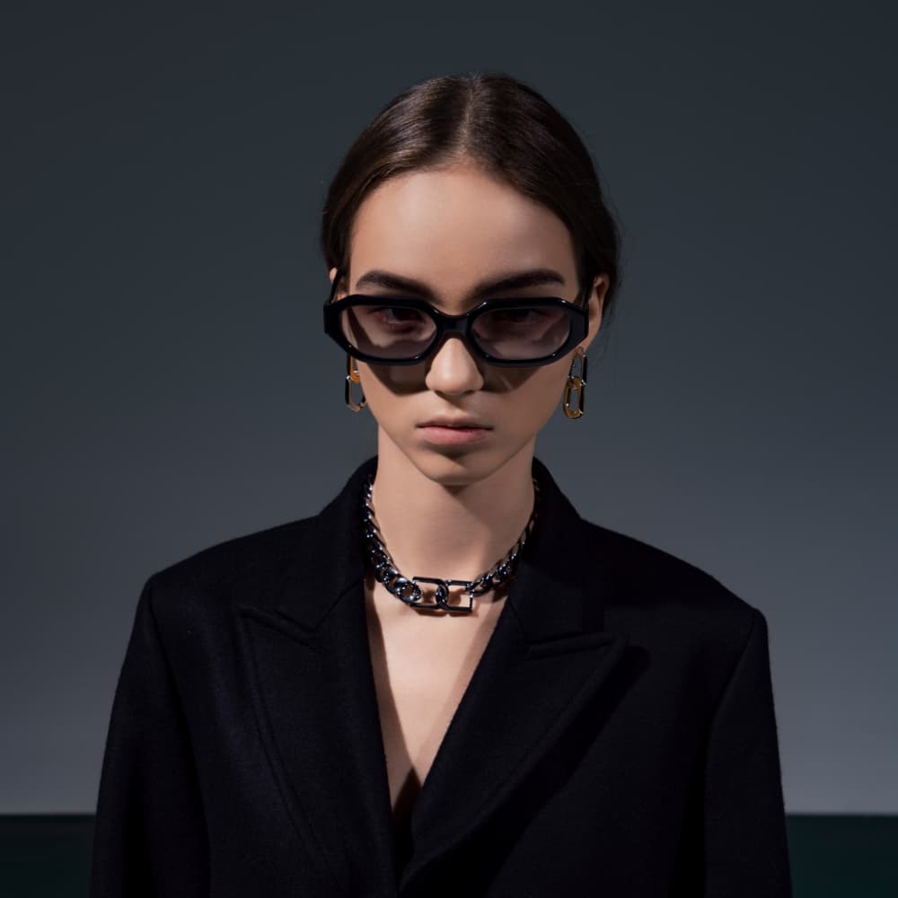 Women's black Gabine recycled acetate oval sunglasses, black Gabine chain-link choker necklace and multi Gabine two-tone chain-link drop earrings - CHARLES & KEITH
