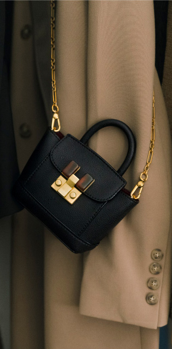 Women’s stone-embellished pouch bag in black (close up) – CHARLES & KEITH