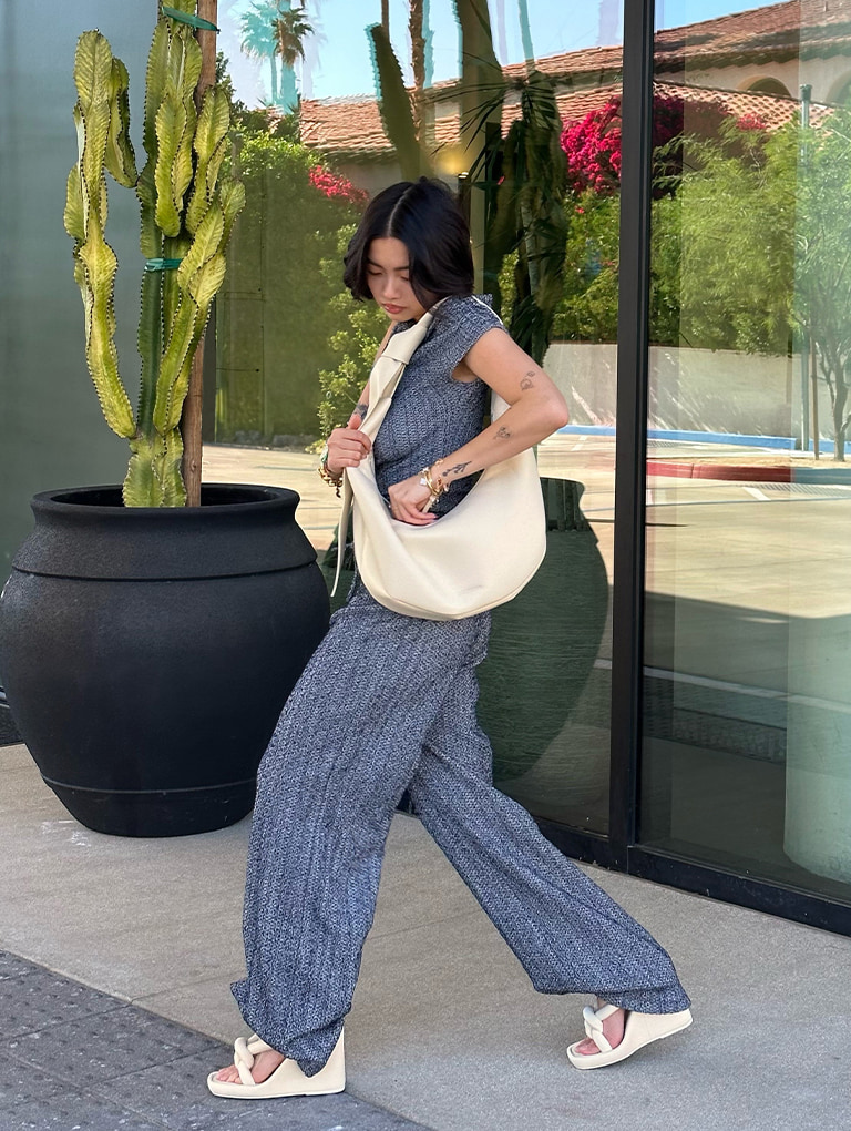 Women’s Toni knotted curved hobo bag in chalk & Toni knotted puffy-strap wedges in chalk, as seen on Stephanie Hui  - CHARLES & KEITH