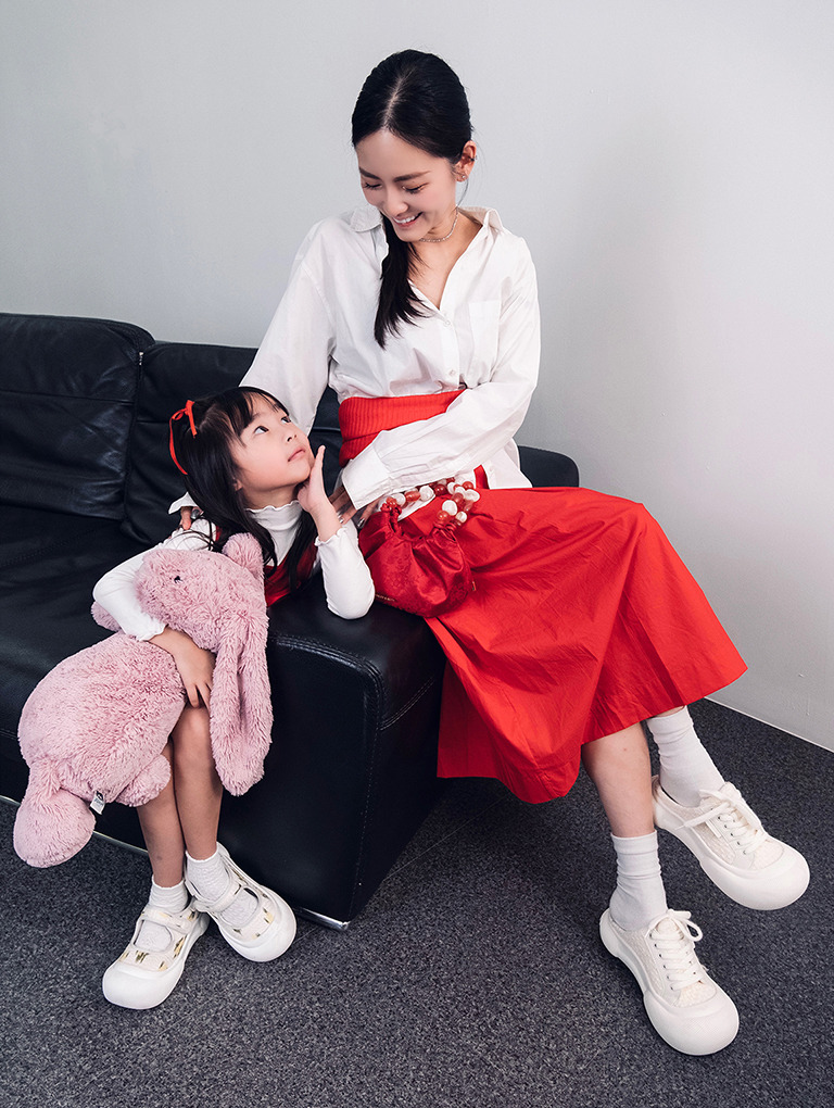 Women’s satin lace-up slip-on sneakers and girls’ floral print Mary Jane sneakers, as seen on Michelle Kong and her daughter 