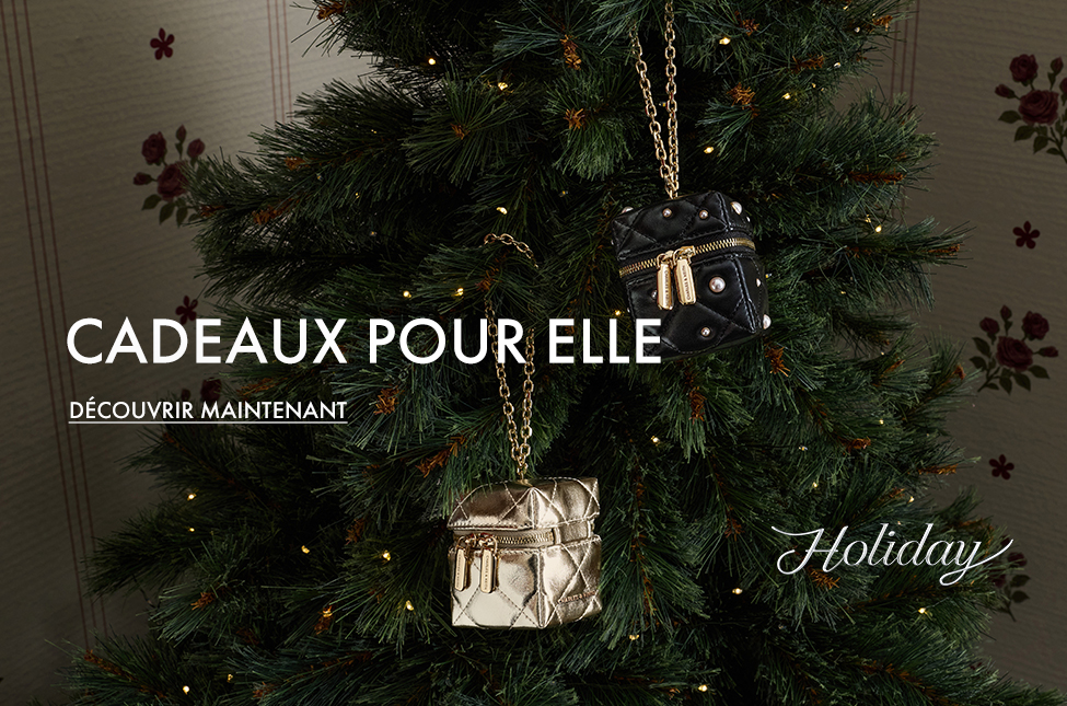 Micro sac boxy matelassé à ornements perles et anse en chaîne Janie en noir
Micro sac boxy métallisé et matelassé à anse en chaîne Janie en champagne