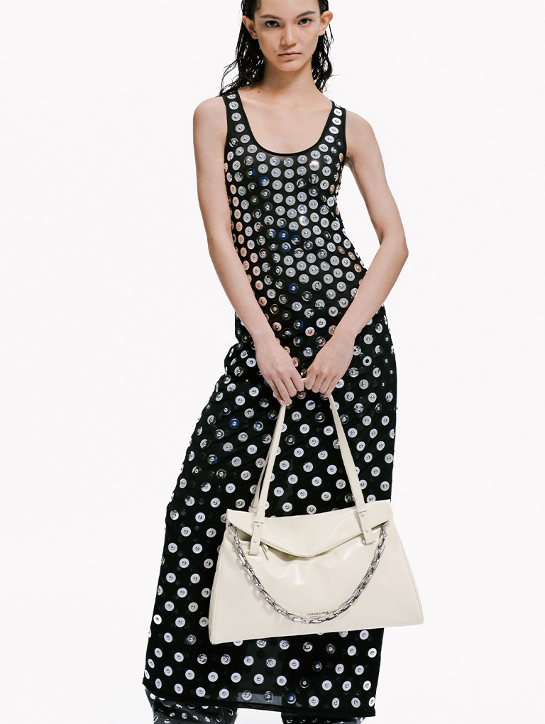 Women’s Neva panelled chain-strap crossbody bag and studded heart-embellished pointed-toe Mary Janes, both in black - CHARLES & KEITH