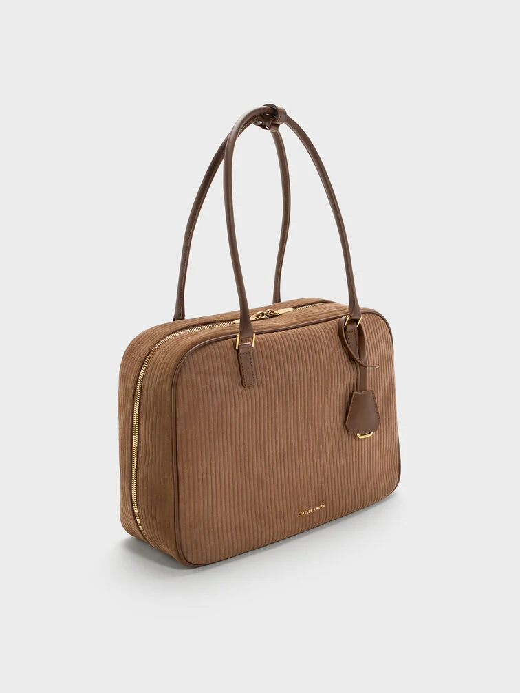 Bowling bags are naturally bigger and taller than East-West bags.