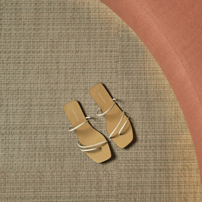 Women’s strappy thong sandals in chalk - CHARLES & KEITH