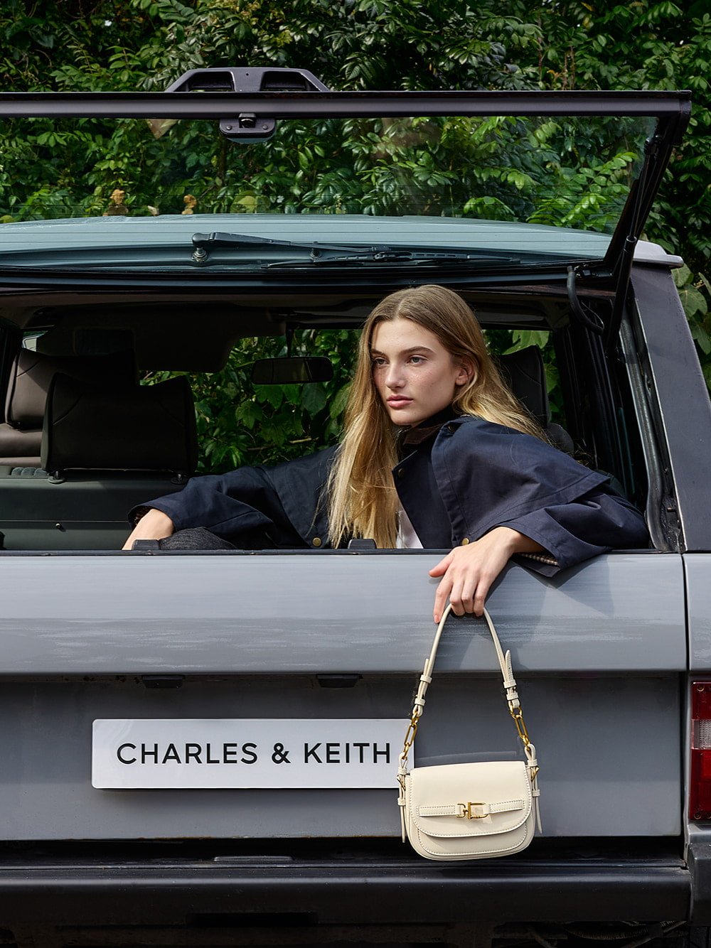 Women’s Gwynne metallic-accent saddle crossbody bag in cream - CHARLES & KEITH