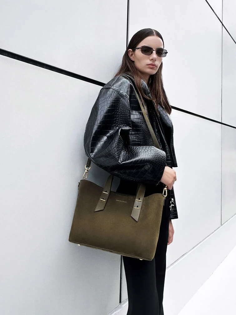 Tote bag offering multiple carrying options with a detachable shoulder strap.