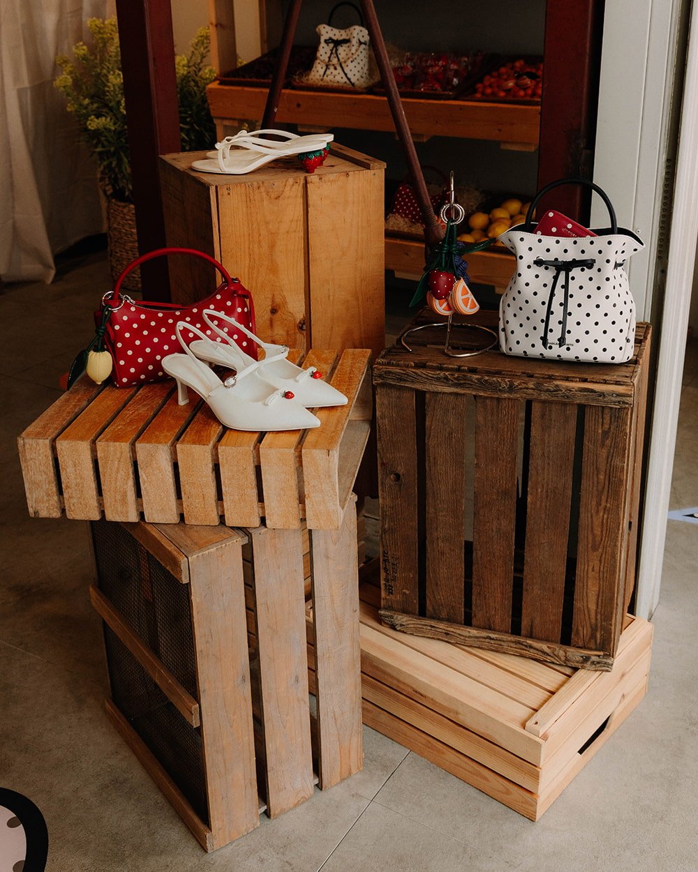 Display of CHARLES & KEITH new seasonal collection on wooden racks