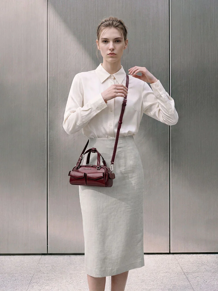 For work, keep your outfit neutral and let one richly coloured bag act as the single outstanding accent in the ensemble.
