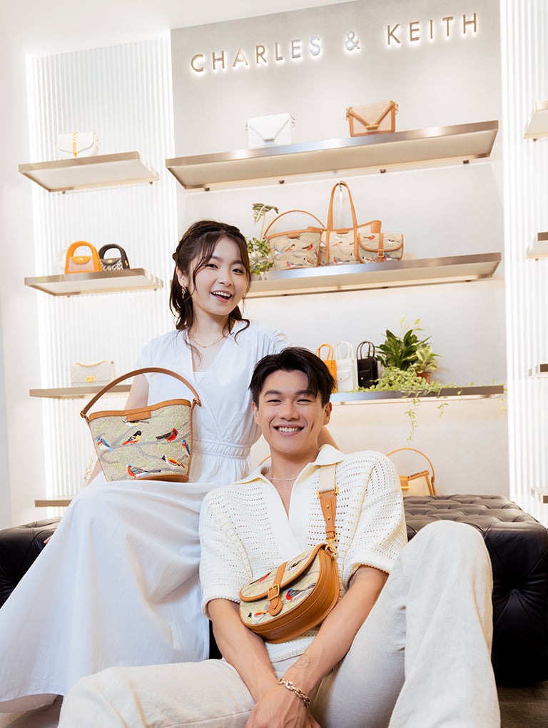 Will Or and Isabella Chang poses in our Summer 2022 Flora collection at the Hong Kong launch event  - CHARLES & KEITH
