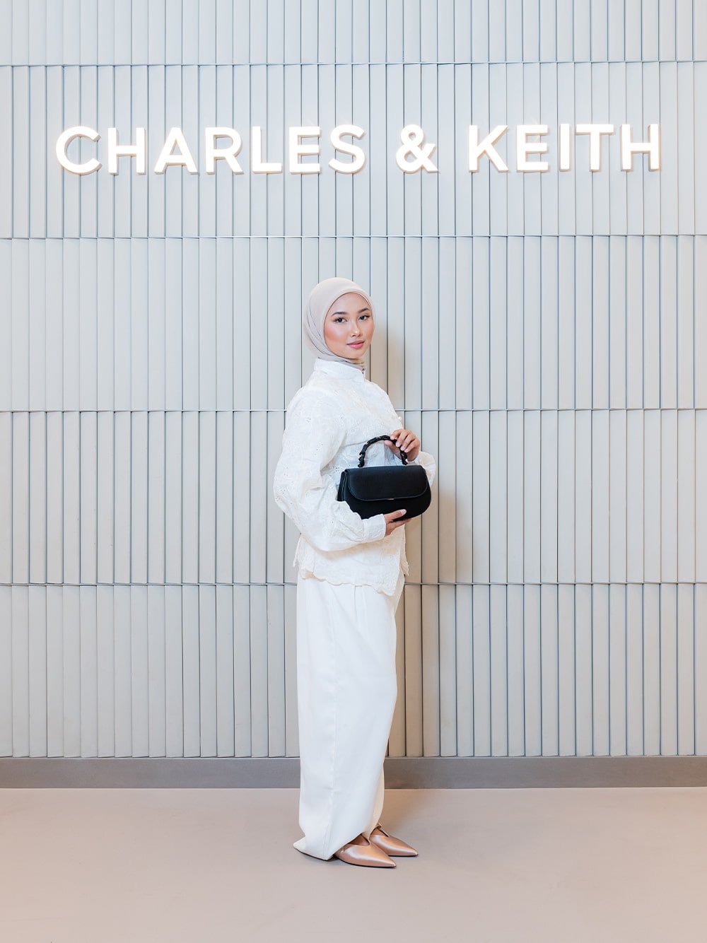 Eilian Satin Braided Top Handle Bag in black textured; Teardrop-Crystal Flat Mules in gold - CHARLES & KEITH