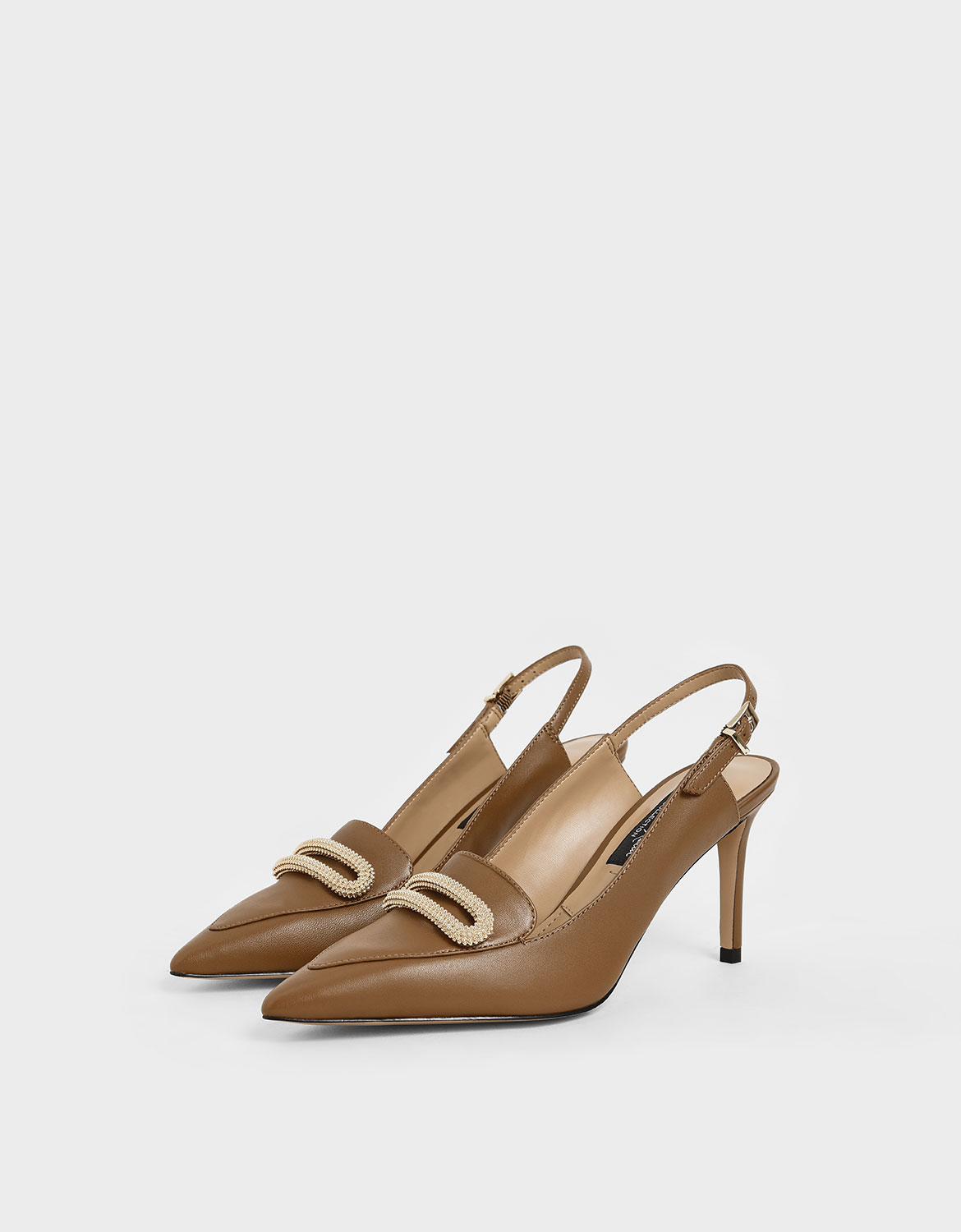 Women’s brown leather metallic accent pumps