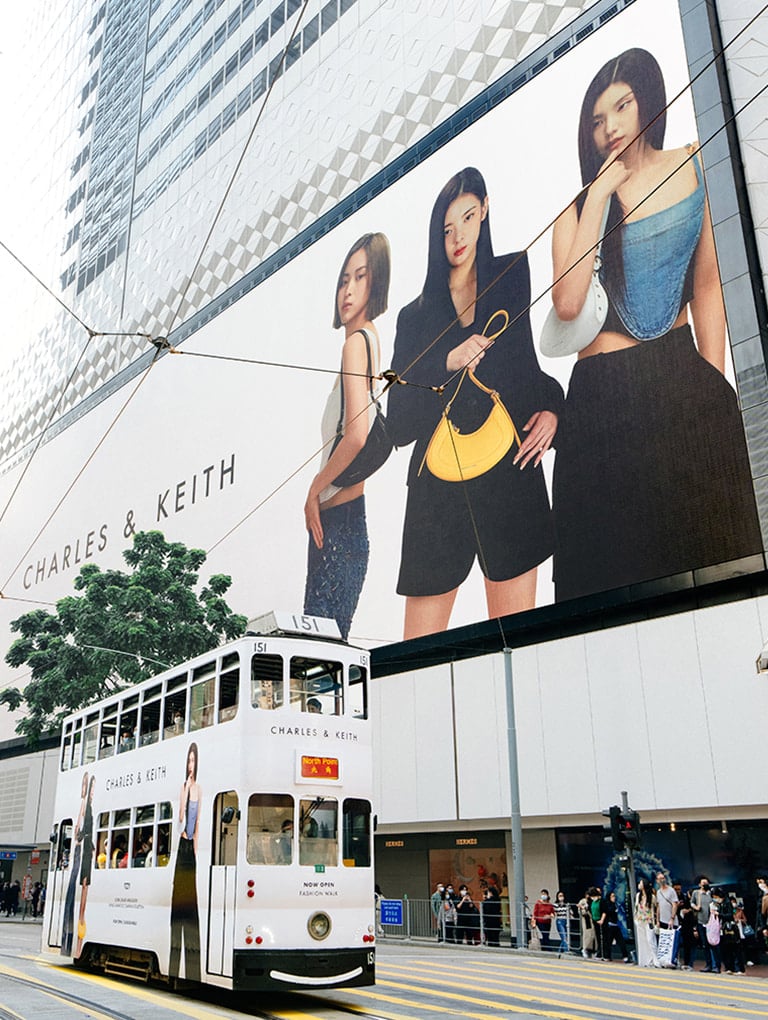 Picture of billboard outside SOGO Causeway Bay, featuring the Spring Summer 2023 campaign with ITZY - CHARLES & KEITH