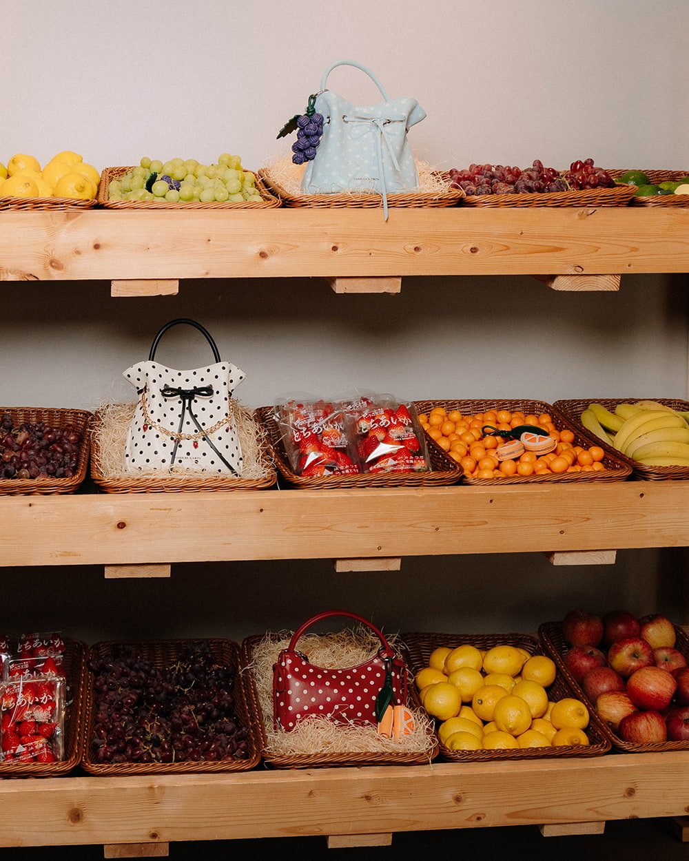 Curated display of the Hazel polka-dot bags and fruit charms