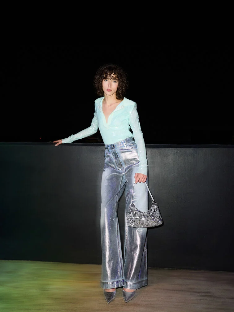 Silver sequinned two-way bag, a festive finishing touch.