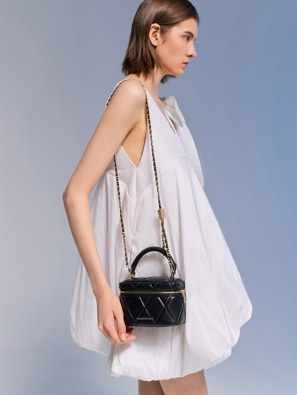 Black Arwen Quilted Top Handle Vanity Bag