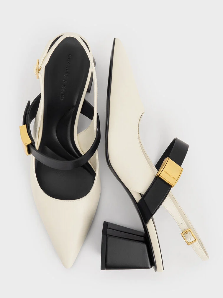 Two-tone Mary Jane slingback pumps, a distinctive footwear choice.