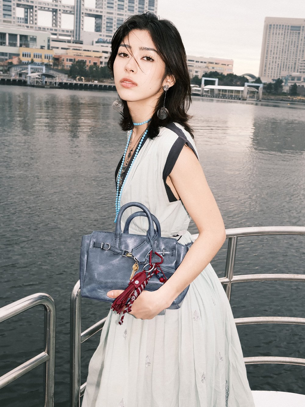 Women’s distressed Delfina belted tote bag and Delfina octopus charm, as seen on Ninon - CHARLES & KEITH