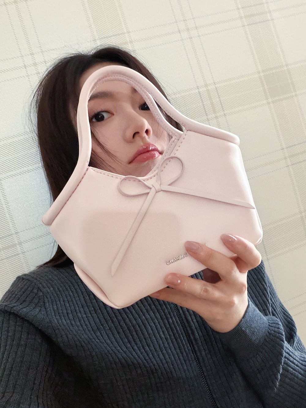 Hazel Bow Tubular Top Handle Bag in soft pink - CHARLES & KEITH