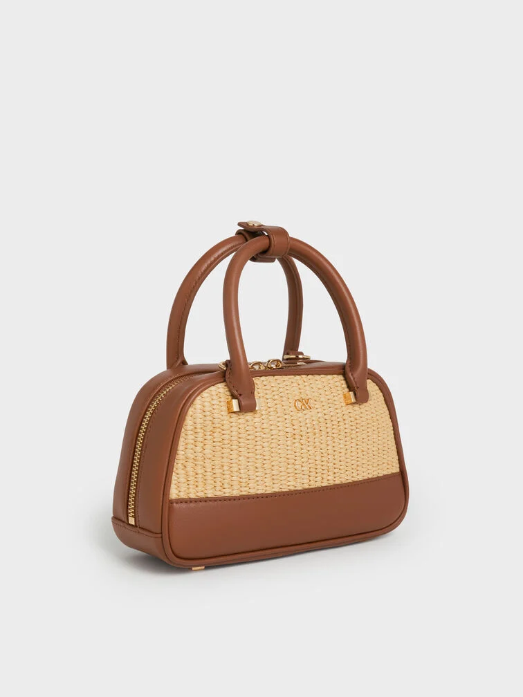 Leather & raffia bowling bag, the perfect plus-one for a chic beach wedding.  